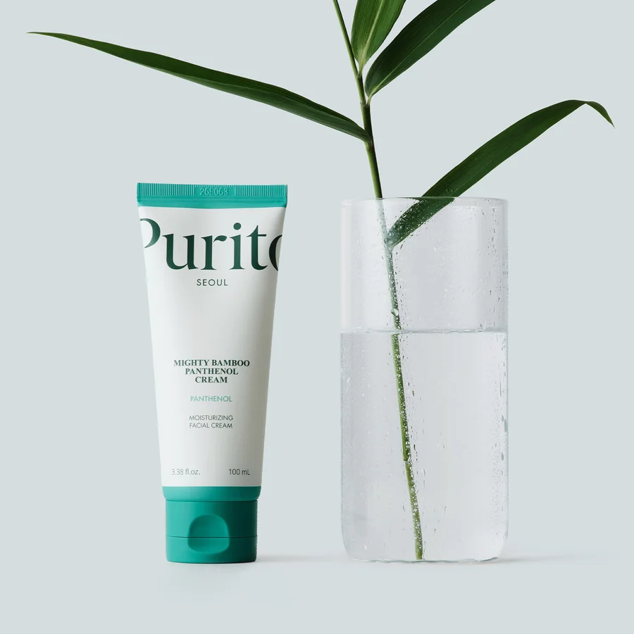 PURITO Panthenol 10% Barrier Cream with a bamboo leaf in a glass of water